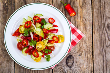 Spicy salad of fresh vegetables with chili