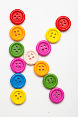 Sewing button alphabet: K