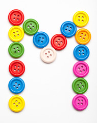Sewing button alphabet: M