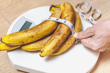 bunch of bananas lying on floor scales