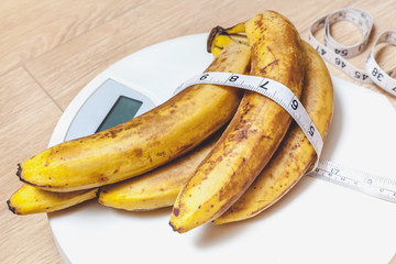 bunch of bananas lying on floor scales