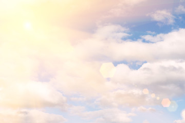 sky with clouds and sun.  A textured background.Copy paste place