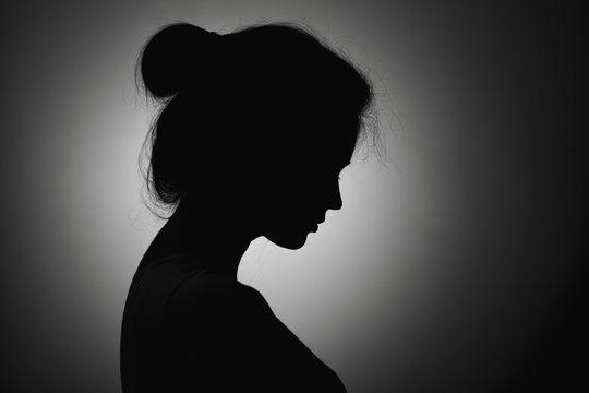 Silhouette of the girl face profile of an unrecognizable sad, woman in  depression put her hand to forehead Stock Photo by ©fantom_rd 168699036