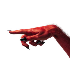 Halloween red devil monster hand with black fingernails against a plain background