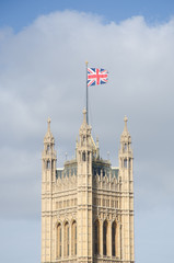 Obraz na płótnie Canvas Westminster Parliament Tower with Flag Flying