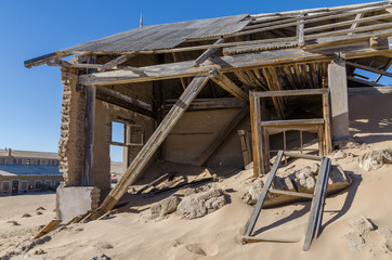 Ruins of once prosperous German mining town Kolmanskop in the Namib desert near Luderitz, Namibia, Southern Africa