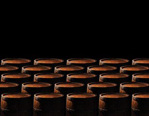 Rustic wooden barrels on a night background