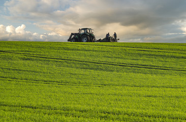 Fototapeta premium tractor during field work on fields in Germany