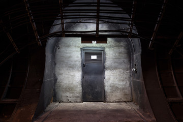 Underground tunnel. Mysterious iron door. Secret entrance.