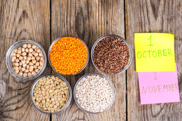 Glass molds with different cereals -concept healthy food for World Vegetarian and Vegan day