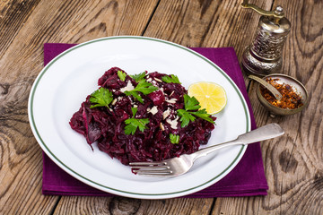 Beetroot dish with cheese on wooden table
