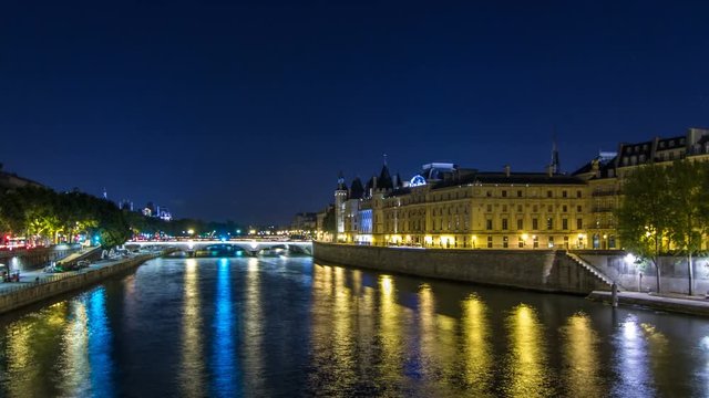 Cite island view with Conciergerie Castle and Pont au Change, over the Seine river timelapse hyperlapse. France, Paris
