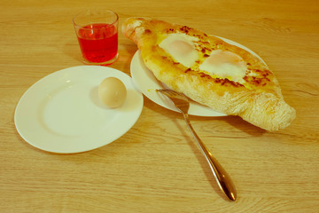 Adjarian khachapuri close-up. This traditional georgian dish con