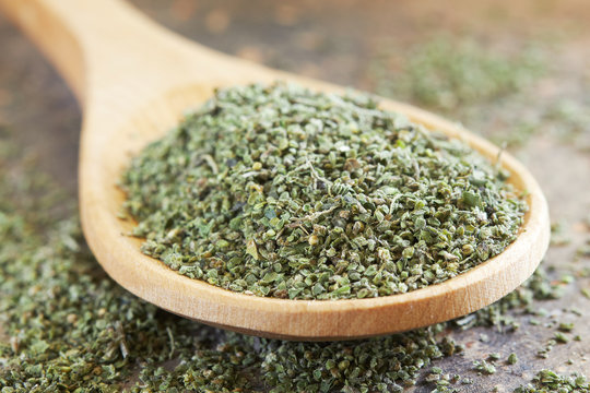 Stinging nettle (Urtica dioica) seeds in wooden spoon