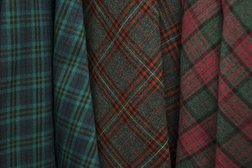 Colors of tartan seamless plaid pattern in fabric store.
