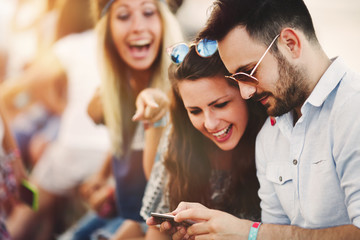 Party people taking selfies during summer festival
