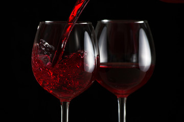 Beautiful splash of red wine in a glass