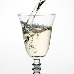 Beautiful splash of wine in a glass