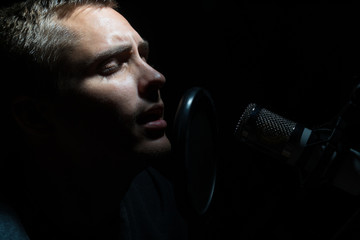 Man singing In Recording Studio with microphone