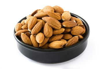 Almonds isolated in black bowl