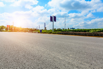 asphalt road and green tree in countryside