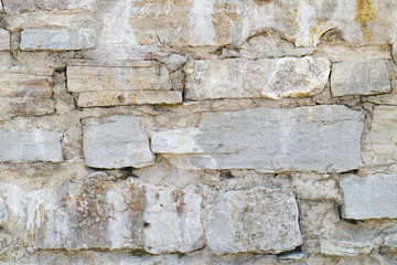 Stone wall of a fortress made from rocks. Background. Texture