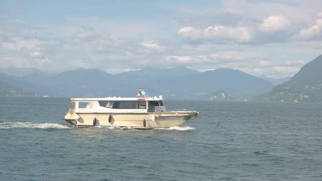 Tourist boat in motion. Vessel on Maggiore lake.
