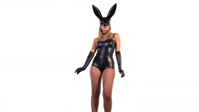 sexy woman dances with large bunny ears mask and black latex body. great clip for disco, party and events