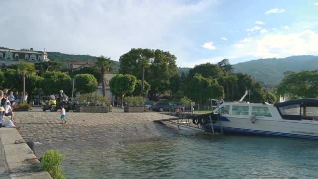 Waterfront of Stresa people. Town nature and sky.