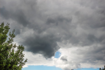 Fototapeta premium Dark clouds or rain cloud before a thunderstorm background.
