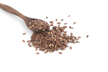 Flax seeds on wooden spoon on white background