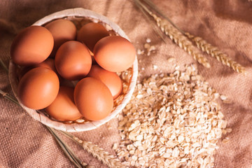 oat flakes, eggs and wheat ears on the table
