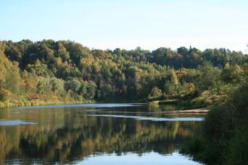 Fototapeta na wymiar fall, trees at river shore