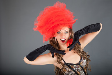 Beautiful Brunette Woman with Red Decoration on Head