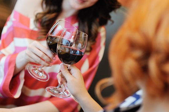 Two Young Women Drinking Wine In A Restaurant. Wine Tasting