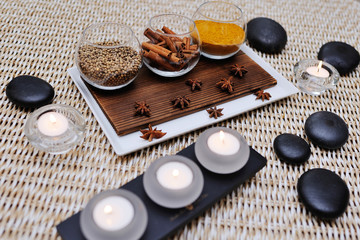 Fototapeta na wymiar spices - turmeric, star anise, cinnamon, cloves, allspice Spa. Aromatherapy, stone therapy.