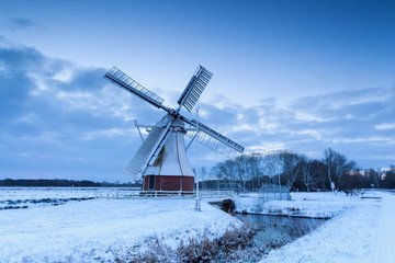 white windmill on snow