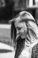 Modest beautiful girl looks down. Portrait of a pretty woman