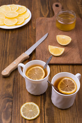 Composition with lemon tea on a wooden table