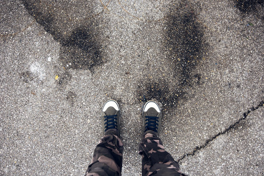 Young Free Adventurous Man Standing On The Street