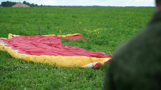 Paraglider red wing at sunny day