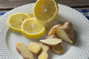 Close up of lemon and ginger in plate