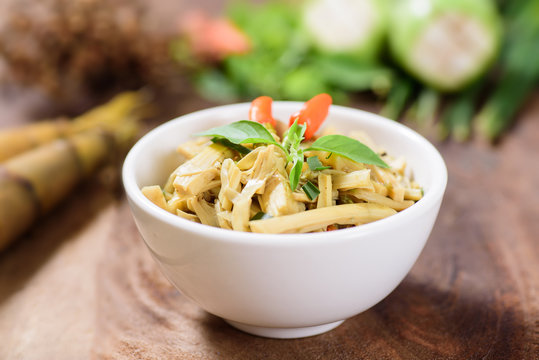 Northern Thai food (Yum Nor Mai),spicy bamboo shoot salad with crab paste  on wooden background