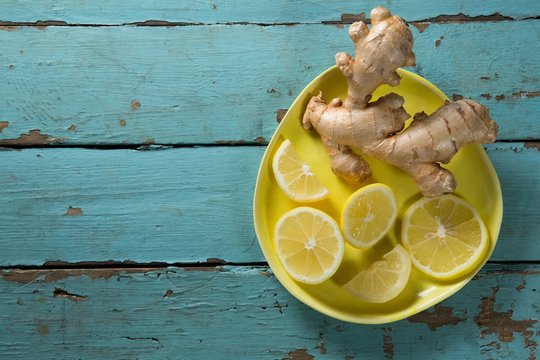 Lemon And Ginger In Yellow Plate On Table