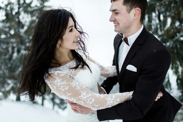 Wedding winter, bride and groom walking at winter wedding day