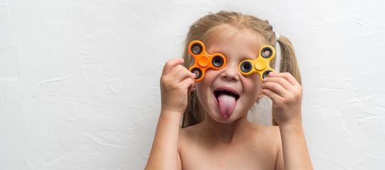 Girl with a spinner in studio