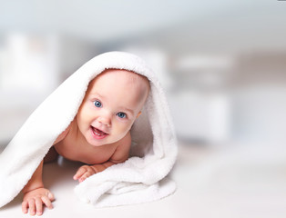Baby portrait in towel. © nys