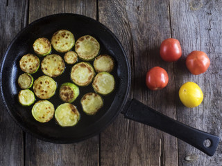 fried zucchini in a frying pan