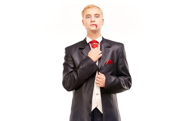 Portrait of handsome young vampire against white background