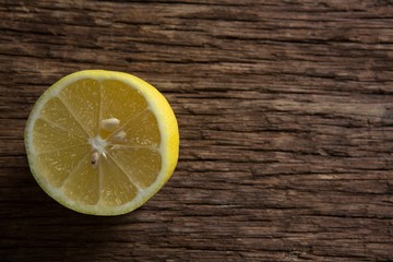 Halved lemon on wooden table